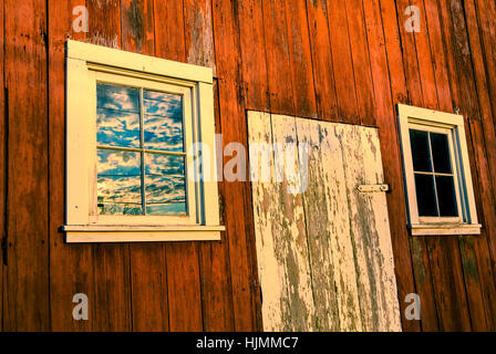 Close-up of red barn door and windows near Sheridan, Indiana, USA. Stock Photo