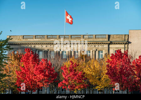 Embassy of Switzerland in Berlin with the Swiss national flag , autumn, Berlin Stock Photo