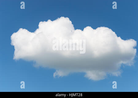 One single fluffy Cumulus cloud in clear deep blue summer sky Stock Photo