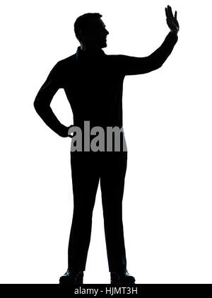 one caucasian business man saluting  silhouette standing Full length in studio isolated on white background Stock Photo