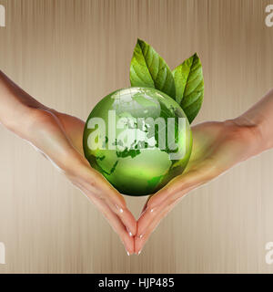 human hands holding green earth with a growing plant Stock Photo - Alamy