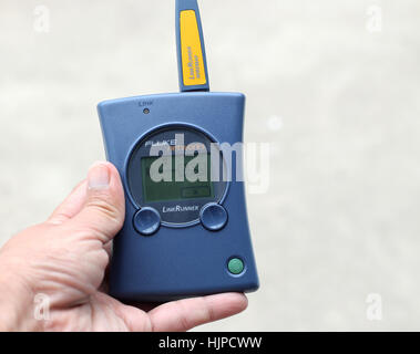 Fluke Networks LinkRunner device in hand isolated Stock Photo