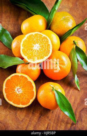 Beautiful fresh tangerines on the table Stock Photo