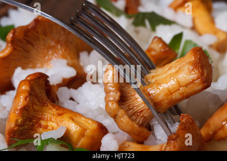 risotto with chanterelles and fork closeup horizontal Stock Photo