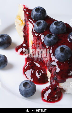 blueberry cheesecake drizzled with berry sauce. macro vertical Stock Photo