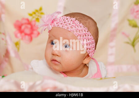 Cute Baby girl on flower blanket Stock Photo