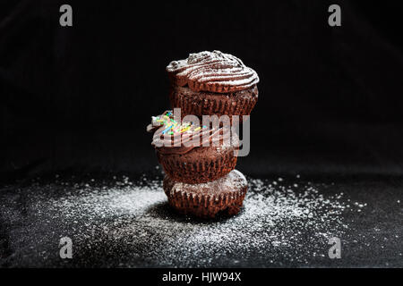 A pile of cakes on a black background Stock Photo