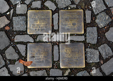 Stolperstein (stumbling stone) on the streets of Berlin. Names of people who lived in the nearby buildings taken by the Nazi's Stock Photo