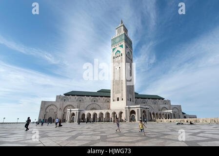 Children playing in front of Hassan II Mosque, Casablanca, Morocco Stock Photo