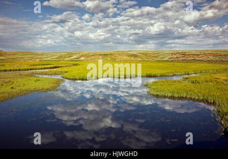 WY02175-00...WYOMING - Clouds and reflections at Elk Antler Creek in the Hayden Valley area of Yellowstone National Park. Stock Photo