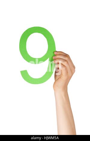 hand holdin up a green number nine, isolated Stock Photo