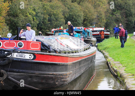 Three old barges wait to go through Appley Lock on the Leeds and Liverpool canal during a flotilla to celebrate the canal being open for 200 years. Stock Photo