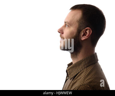 Side view of young bearded man isolated on gray background Stock Photo