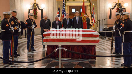 Speaker of the Ohio House of Representatives Cliff Rosenberger, left, NASA Administrator Charles Bolden, Ohio Gov. John Kasich, and Secretary of State John Kerry pay their respects to former astronaut and U.S. Senator John Glenn as he lies in repose, under a United States Marine honor guard, in the Rotunda of the Ohio Statehouse in Columbus, Friday, Dec. 16, 2016. Stock Photo