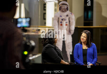 American actress Octavia Spencer, left, speaks with NASA Astrophysics Division Deputy Director Andrea Razzaghi, right, about the movie “Hidden Figures” during taping of media interviews, Tuesday, Dec. 13, 2016, at the Smithsonian’s National Air and Space Museum in Washington, DC. The film is based on the book of the same title, by Margot Lee Shetterly, and chronicles the lives of Katherine Johnson, Dorothy Vaughan and Mary Jackson -- African-American women working at NASA as “human computers,” who were critical to the success of John Glenn’s Friendship 7 mission in 1962. Stock Photo