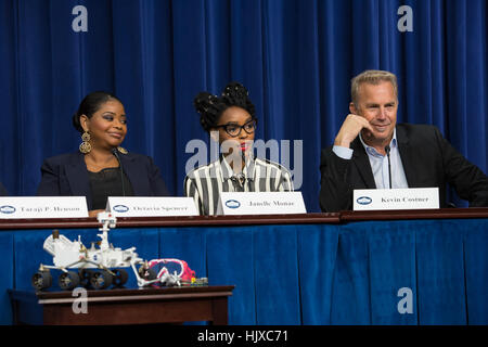 American musical recording artist, actress, and model Janelle Monáe, center, speaks on a panel with fellow cast members, Octavia Spencer, left, and Kevin Costner, right, after a screening of the film “Hidden Figures” at the White House, Thursday, Dec. 15, 2016 in Washington. The film is based on the book of the same title, by Margot Lee Shetterly, and chronicles the lives of Katherine Johnson, Dorothy Vaughan and Mary Jackson -- African-American women working at NASA as “human computers,” who were critical to the success of John Glenn’s Friendship 7 mission in 1962.  /Aubrey Gemignani) Stock Photo