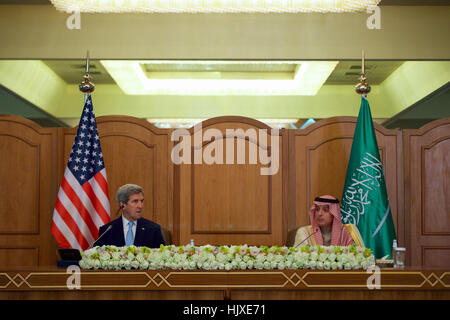 U.S. Secretary of State John Kerry listens to Saudi Arabia Foreign Minister Adel al-Jubeir as he addresses reporters after they and counterparts from the United Kingdom, United Arab Emirates, Oman, and the United Nations met on December 18, 2016, at the Conference Palace Hotel in Riyadh, Saudi Arabia, to discuss the future of Yemen. Stock Photo