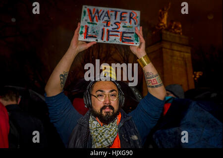 New York, USA. 24th Jan, 2017. Hundreds of New Yorkers joined Actress Jane Fonda and Film Director Josh Fox in the evening of January 24 at Columbus Circle in New York for a rally and march to Trump Tower in a massive peaceful protest after Trump signs orders to advance Keystone XL and Dakota Access Pipelines. Credit: Erik McGregor/Pacific Press/Alamy Live News Stock Photo