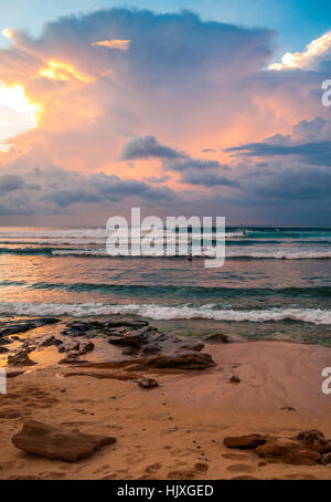 The picturesque clouds over rocky beach on uninhabited island Half Moon ...