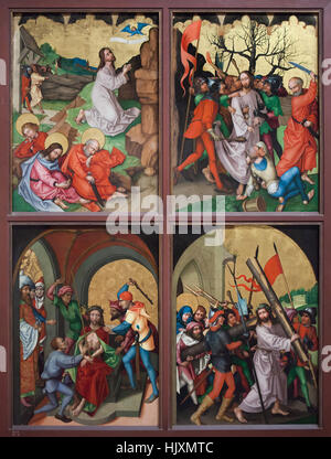 Wing of the altarpiece from circa 1480 by German Renaissance painter Martin Schongauer from the Dominican Church in Colmar on display in the Musee d'Unterlinden (Unterlinden Museum) in Colmar, Alsace, France. Depicted scenes (from left to right from top to bottom): Agony in the Garden, Kiss of Judas Iscariot, Mocking of Christ and Christ carrying the cross. Stock Photo