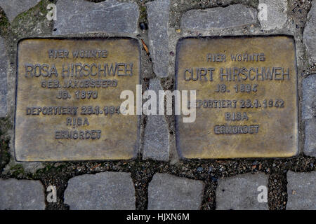 Stolperstein (stumbling stone) on the streets of Berlin (commemorating Rosa and Curt Hirschweh) Stock Photo