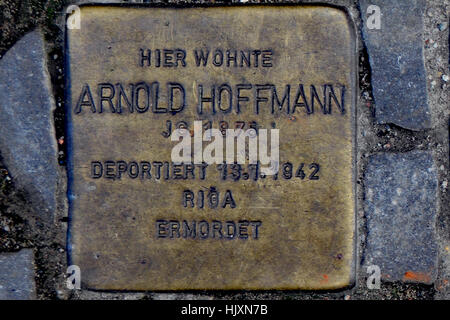 Stolperstein (stumbling stone) on the streets of Berlin (commemorating Arnold Hoffman) Stock Photo
