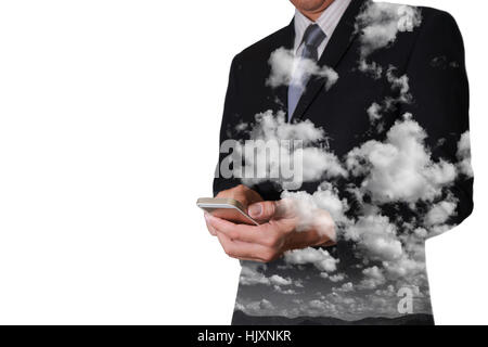 Double exposure of business man hand hold and touch screen smart phone, clouds and sky as Cloud Computing Network concept. Stock Photo