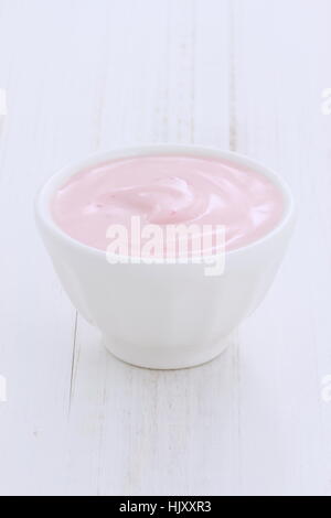 Delicious, nutritious and healthy fresh strawberry yogurt on wood marble. Stock Photo