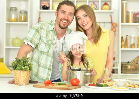 family cooking soup Stock Photo