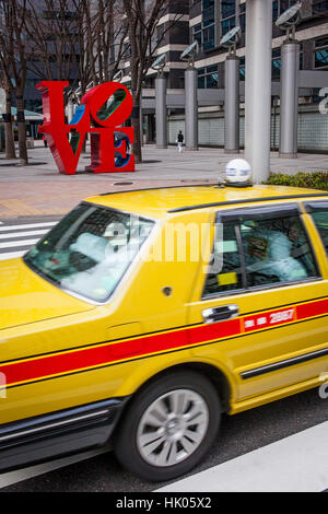 Townscape, Love-sculpture by American artist Robert Indiana, West Side, Shinjuku district, Tokyo, Japan Stock Photo