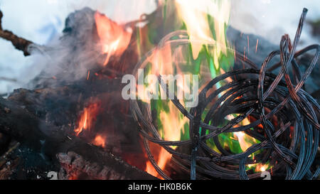 Firing wire in fire Stock Photo