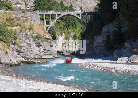 Jet boat on the Shotover River below the Edith Cavell Bridge, Queenstown, Queenstown-Lakes district, Otago, New Zealand Stock Photo