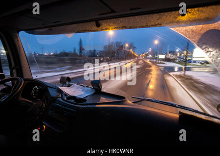 View from a cab on the road in winter in the dark Stock Photo