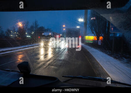 View from a cab on the road in winter in the dark Stock Photo