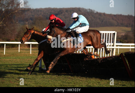 Brave Eagle ridden by jockey Jeremiah McGrath (left) jumps the final hurdle to win beating Oxwich Bay ridden by jockey Adam Wedge in The Racing UK National Hunt Maiden Hurdle at Ludlow Racecourse. Stock Photo