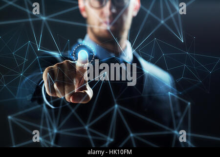 businessman with virtual network hologram Stock Photo