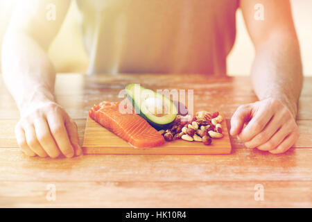 close up of male hands with food rich in protein Stock Photo