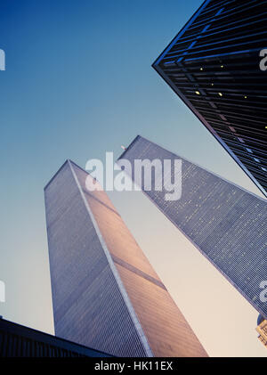 The original World Trade Center Twin Towers at dusk with sun light raking the building Stock Photo