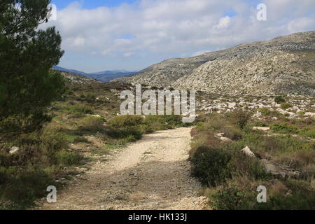 Mountain path in carboniferous limestone landscape, near Benimaurell, Vall de Laguar, Marina Alta, Alicante province, Spain Stock Photo