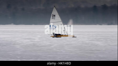 Steinebach, Germany. 25th Jan, 2017. An ice yachter slides over the frozen Woerthsee lake near Steinebach, Germany, 25 January 2017. Photo: Peter Kneffel/dpa/Alamy Live News Stock Photo