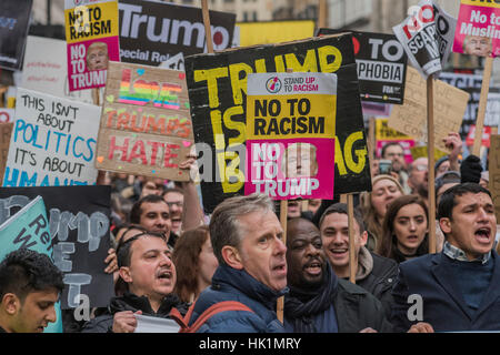 London, UK. 4th February, 2017. A march against racism and to ban the ban (against immigration from certain countries to the USA) is organised by Stand Up To Racism and supported by Stop the War and several unions. It stated with a rally at the US Embassy in grosvenor Square and ended up in Whitehall outside Downing Street. Thousands of people of all races and ages attended. London 04 Feb 2017. Credit: Guy Bell/Alamy Live News Stock Photo