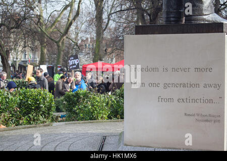 London, UK. 4th February, 2017. Regan statue and quote on Freedom at 4th Feb 2017 London March against Donald Trump Credit: Pauline A Yates/Alamy Live News Stock Photo