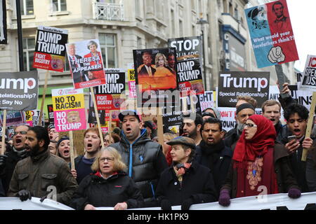 London, UK. 4th February, 2017. Demonstrators and placards. A protest at the American embassy in Grosvenor Square against president Trumps recent policy banning immigrants travelling from several Muslim countries to the USA. Penelope Barritt/Alamy Live News Stock Photo