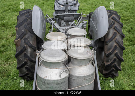 Grey Ferguson tractor with milk churns Stock Photo