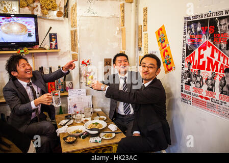 Coworkers, in Ebisu Yokochou restaurant, Tokyo, Japan Stock Photo