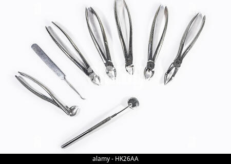 Dental Instruments arranged on white table. Stock Photo