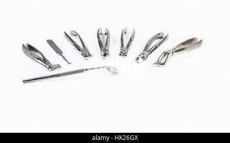 Dental Instruments arranged on white table. Stock Photo
