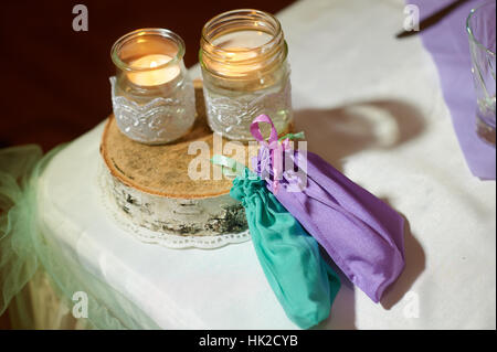 Wedding decoration of the candles on the table in a rustic style Stock Photo