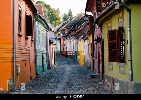 Colorful houses on a street in Sighisoara Medieval Citadel Stock Photo