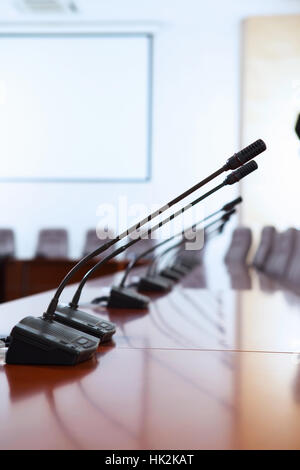 before a conference, the microphones in front of empty chairs Stock ...